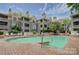 A condo community features a well-maintained swimming pool, perfect for summer relaxation at 226 Queens Rd # 68, Charlotte, NC 28204