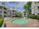 A refreshing condo swimming pool features a brick deck, lounge chairs, and community building at 226 Queens Rd # 68, Charlotte, NC 28204