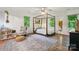This spacious bedroom is filled with natural light and features a four poster bed and hardwood floors at 2507 Connemara Dr, Matthews, NC 28105