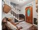 Welcoming entryway with wooden door, bench seating, decor, and staircase to the upper level at 2507 Connemara Dr, Matthews, NC 28105