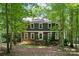 Charming two-story home with a neatly maintained front yard and beautiful surrounding trees at 2507 Connemara Dr, Matthews, NC 28105