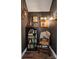 Hallway features wood paneled walls, unique decor, and a curated display of antique artifacts at 2507 Connemara Dr, Matthews, NC 28105