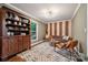 Inviting living room featuring hardwood floors, unique decor, and a comfortable seating arrangement at 2507 Connemara Dr, Matthews, NC 28105
