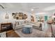 Spacious living room with a neutral sectional, hardwood floors, and charming decorative wall art at 2507 Connemara Dr, Matthews, NC 28105