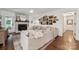 Cozy living room with stone fireplace, neutral decor, and hardwood floors, perfect for relaxing at 2507 Connemara Dr, Matthews, NC 28105
