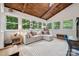 Bright sunroom with vaulted ceilings, tile floors, and natural light, perfect for relaxing or entertaining at 2507 Connemara Dr, Matthews, NC 28105