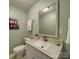 Clean, well-lit bathroom featuring a large mirror and a vanity sink at 2666 Hill Ln, Gastonia, NC 28054