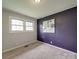 Bedroom features two windows and one accent wall at 2666 Hill Ln, Gastonia, NC 28054