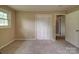 Neutral bedroom features a window for natural light and closet for storage at 2666 Hill Ln, Gastonia, NC 28054