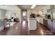 Bright kitchen featuring an island, stainless steel appliances, and seamless connection to the living spaces at 2666 Hill Ln, Gastonia, NC 28054