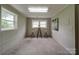 Living room includes a bar table and chairs with lots of light at 2666 Hill Ln, Gastonia, NC 28054