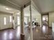 Inviting living room with hardwood floors, neutral paint, and an open layout, creating a warm atmosphere at 2666 Hill Ln, Gastonia, NC 28054