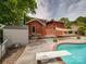 Backyard featuring a pool, storage shed, and exterior home entrance at 2666 Hill Ln, Gastonia, NC 28054