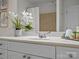 Bathroom featuring a pristine white vanity with a mirrored backsplash, enhancing the room's brightness and appeal at 300 W 5Th St # 433, Charlotte, NC 28202