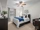 Cozy bedroom with a ceiling fan, carpet and a large window with natural light at 300 W 5Th St # 433, Charlotte, NC 28202