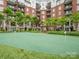 Green putting-range, surrounded by multi-story condo building and manicured landscaping at 300 W 5Th St # 433, Charlotte, NC 28202