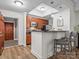Inviting kitchen featuring wood cabinets, breakfast bar with seating, and stainless steel appliances for modern living at 300 W 5Th St # 433, Charlotte, NC 28202