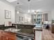 Open kitchen with granite counters and a breakfast bar offering views of the living area and outdoor balcony at 300 W 5Th St # 433, Charlotte, NC 28202