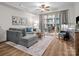 Bright living room featuring a plush sofa and balcony access, perfect for relaxing or entertaining at 300 W 5Th St # 433, Charlotte, NC 28202