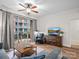 Comfortable living room with a sliding glass door to the balcony and entertainment center at 300 W 5Th St # 433, Charlotte, NC 28202