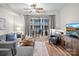 Bright living room featuring a plush sofa and balcony access, perfect for relaxing or entertaining at 300 W 5Th St # 433, Charlotte, NC 28202