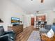 Inviting living room with wood floors, comfortable seating, and an open view into the kitchen at 300 W 5Th St # 433, Charlotte, NC 28202