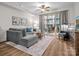 Bright living room featuring a plush sofa and balcony access, perfect for relaxing or entertaining at 300 W 5Th St # 433, Charlotte, NC 28202