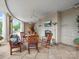 Covered patio featuring a stone fireplace, TV, ceiling fans, and an assortment of comfortable seating at 300 W 5Th St # 433, Charlotte, NC 28202