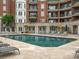 Relax by the community pool, surrounded by lounge chairs and lush landscaping, perfect for enjoying sunny days at 300 W 5Th St # 433, Charlotte, NC 28202