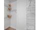 Spacious walk-in closet with white wire shelving and a neutral carpet, providing ample storage space at 300 W 5Th St # 433, Charlotte, NC 28202