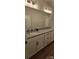Bright bathroom with a double sink vanity, granite countertop, and modern fixtures at 320 Lawrence Gray Rd, Charlotte, NC 28262