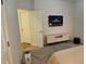 Bright bedroom with tv, closet and neutral walls and carpet at 320 Lawrence Gray Rd, Charlotte, NC 28262