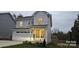 Charming two-story home with a neutral exterior, attached garage, and well-maintained front yard at 320 Lawrence Gray Rd, Charlotte, NC 28262