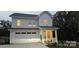 Charming two-story home features a white exterior, attached garage, and well-maintained landscaping at 320 Lawrence Gray Rd, Charlotte, NC 28262