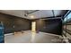 Spacious two-car garage with finished walls and flooring, providing ample room for vehicles and storage at 320 Lawrence Gray Rd, Charlotte, NC 28262
