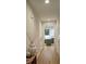 Inviting hallway with hardwood flooring, neutral walls, and a view into the kitchen at 320 Lawrence Gray Rd, Charlotte, NC 28262