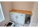 Laundry area with cabinet and counter space for folding and storage at 320 Lawrence Gray Rd, Charlotte, NC 28262