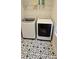 Laundry room featuring a modern washer and dryer and decorative tiled flooring at 320 Lawrence Gray Rd, Charlotte, NC 28262