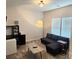 Living room with a gray sofa, a modern lamp, a coffee table, a desk and neutral carpeting at 320 Lawrence Gray Rd, Charlotte, NC 28262