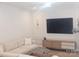 Comfortable living space with a stylish sofa, entertainment center, and minimalist decor at 320 Lawrence Gray Rd, Charlotte, NC 28262