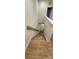 Wood-style stairs with white railings, providing a clean and modern look for the home at 320 Lawrence Gray Rd, Charlotte, NC 28262