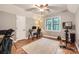 This versatile bonus room boasts a large window, wood floors, and space for a home office or workout area at 3214 Tilley Morris Rd, Matthews, NC 28105