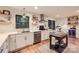 Bright kitchen features white cabinets, stainless appliances, shiplap walls and butcher block island at 3214 Tilley Morris Rd, Matthews, NC 28105