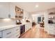 Well-equipped kitchen showcases ample counter space, wine fridge and modern cabinetry, seamlessly designed at 3214 Tilley Morris Rd, Matthews, NC 28105