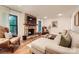 Cozy living room features a stone fireplace, comfortable seating, and inviting natural light at 3214 Tilley Morris Rd, Matthews, NC 28105