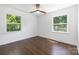 Bedroom offering hardwood floors and bright windows showcasing beautiful outdoor greenery at 4017 Sulkirk Rd, Charlotte, NC 28210