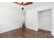 Bedroom featuring hardwood floors, ceiling fan, and large closet at 4017 Sulkirk Rd, Charlotte, NC 28210