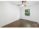 Bright bedroom with hardwood floors, ceiling fan, and a window at 4017 Sulkirk Rd, Charlotte, NC 28210
