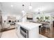Open kitchen featuring stainless appliances and views of the dining and living areas at 4017 Sulkirk Rd, Charlotte, NC 28210