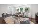 Bright living room filled with natural light and stylish, neutral furniture at 4017 Sulkirk Rd, Charlotte, NC 28210